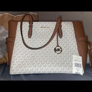 Brand new never used Michael Kors tote bag and wallet! Taking best offer!